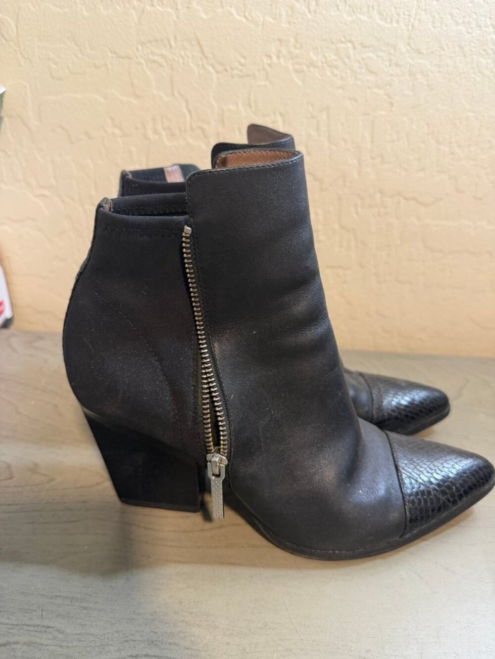 Black ankle boots with snakeskin toe